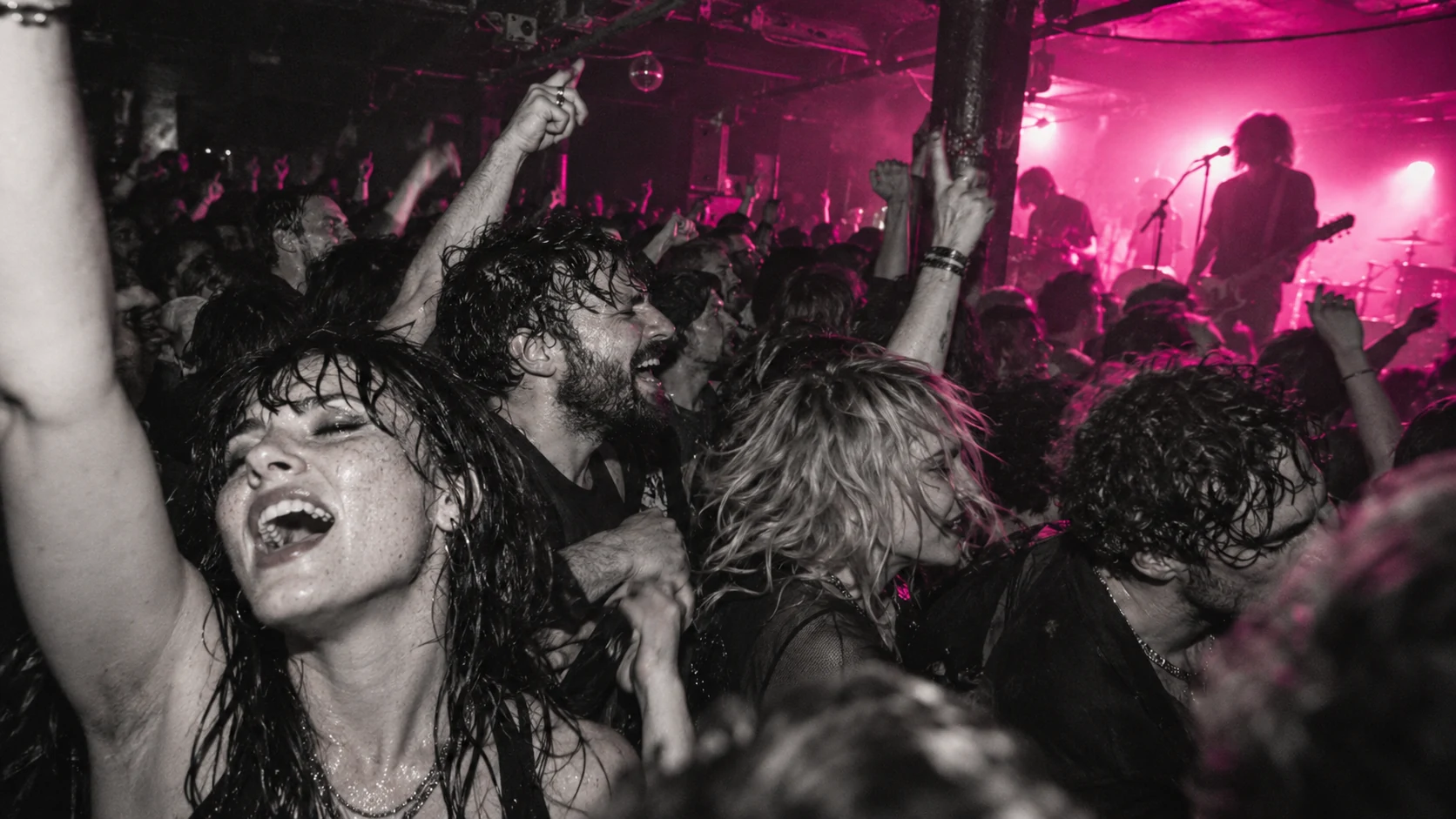 Music and culture platform concept: an energetic concert audience beneath magenta stage lights